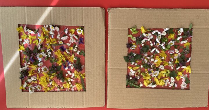 Dzieci robią obrazek z kwiatków.